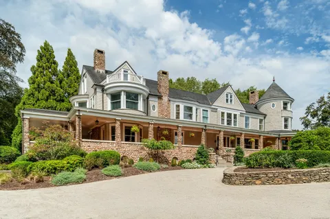 front view of a house with a garden