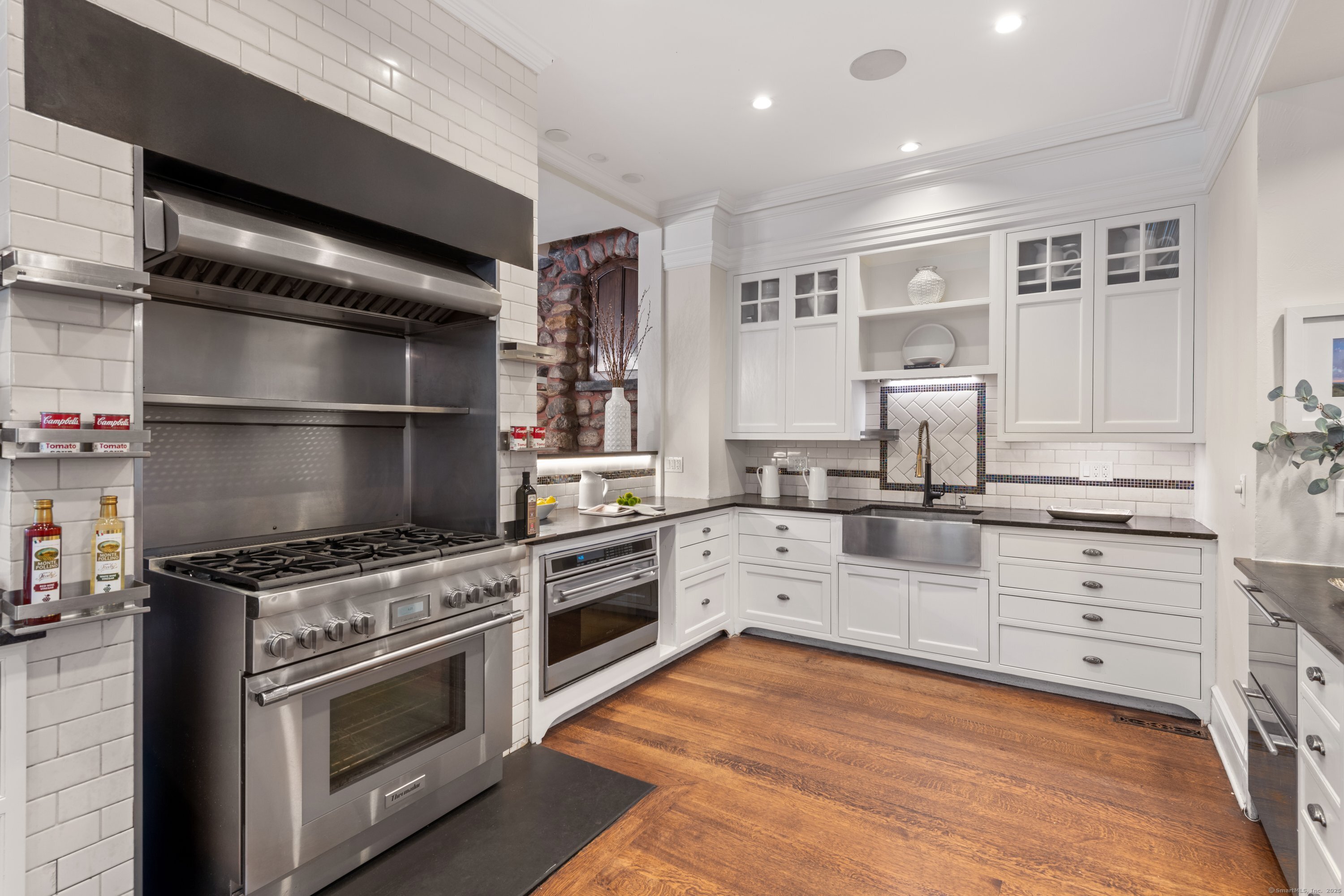 249 Greens Farms Road Westport, CT 06880 - Photo 12 of 40 a kitchen with a stove oven and sink