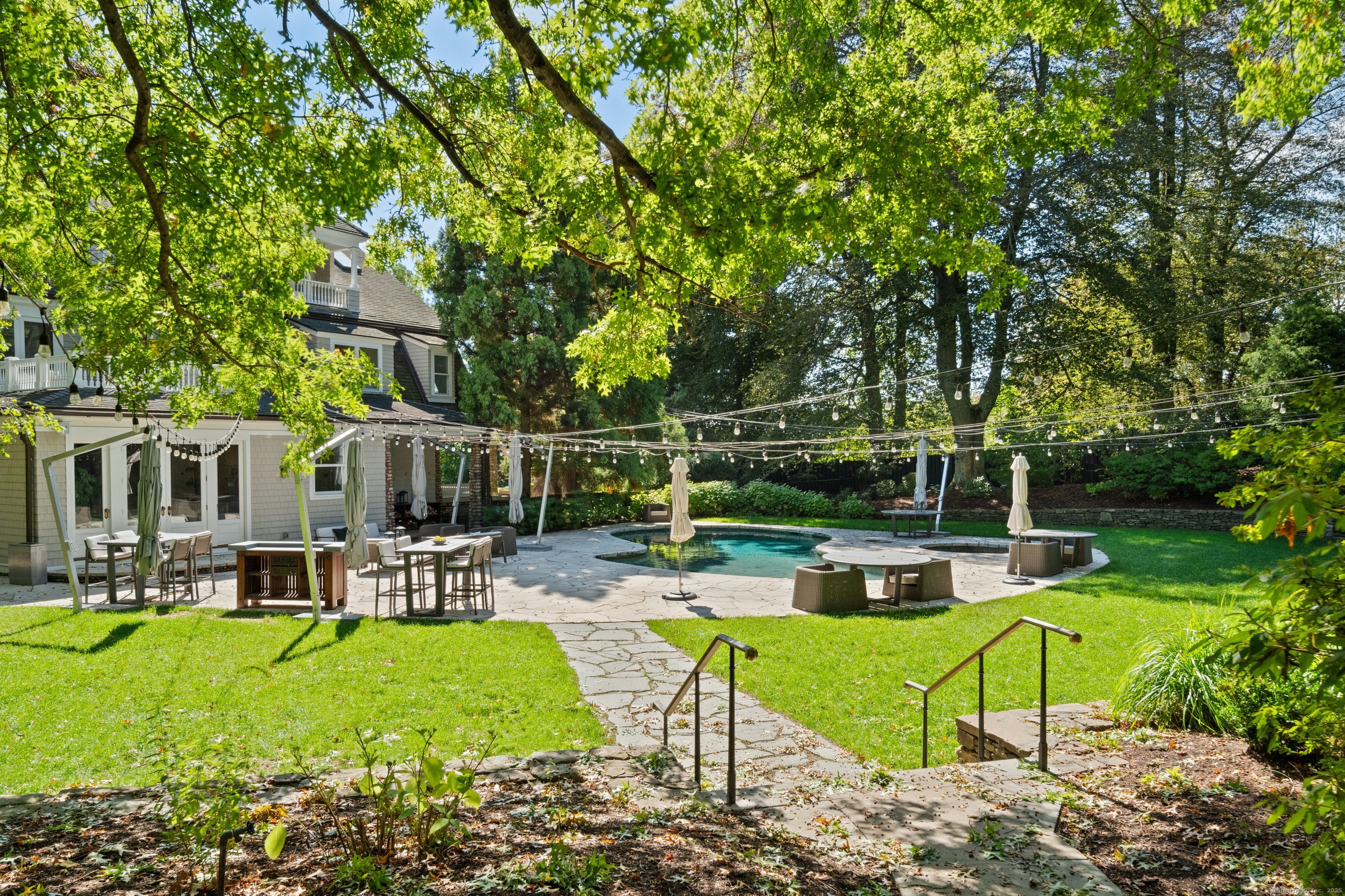249 Greens Farms Road Westport, CT 06880 - Photo 12 of 40 a view of backyard with swimming pool and seating space