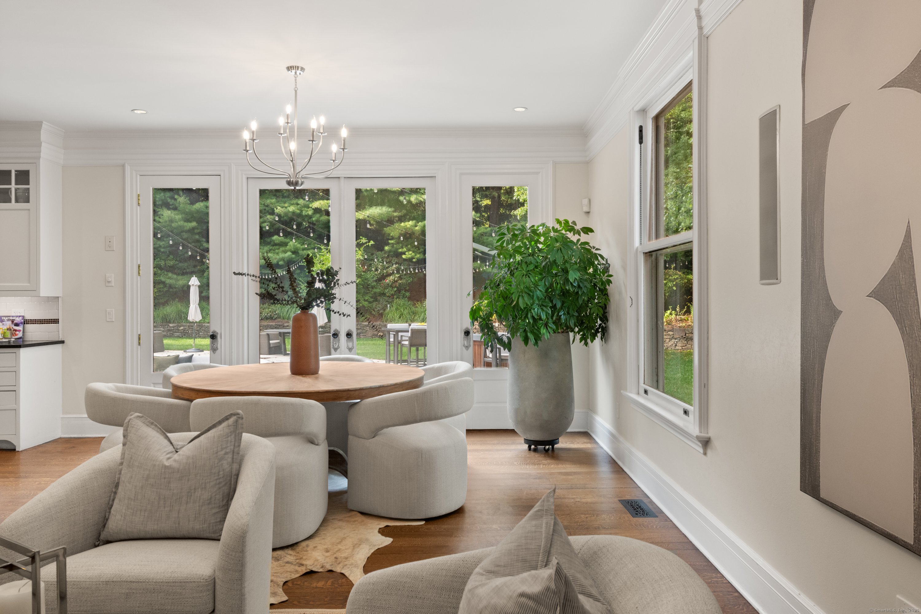 249 Greens Farms Road Westport, CT 06880 - Photo 14 of 40 a living room with furniture and a chandelier