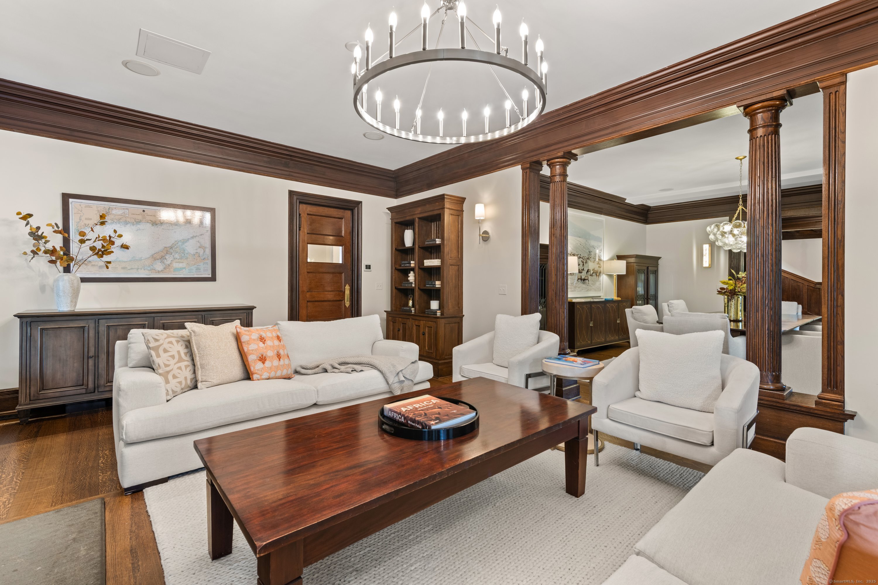 249 Greens Farms Road Westport, CT 06880 - Photo 19 of 40 a living room with furniture a dining table and a large window