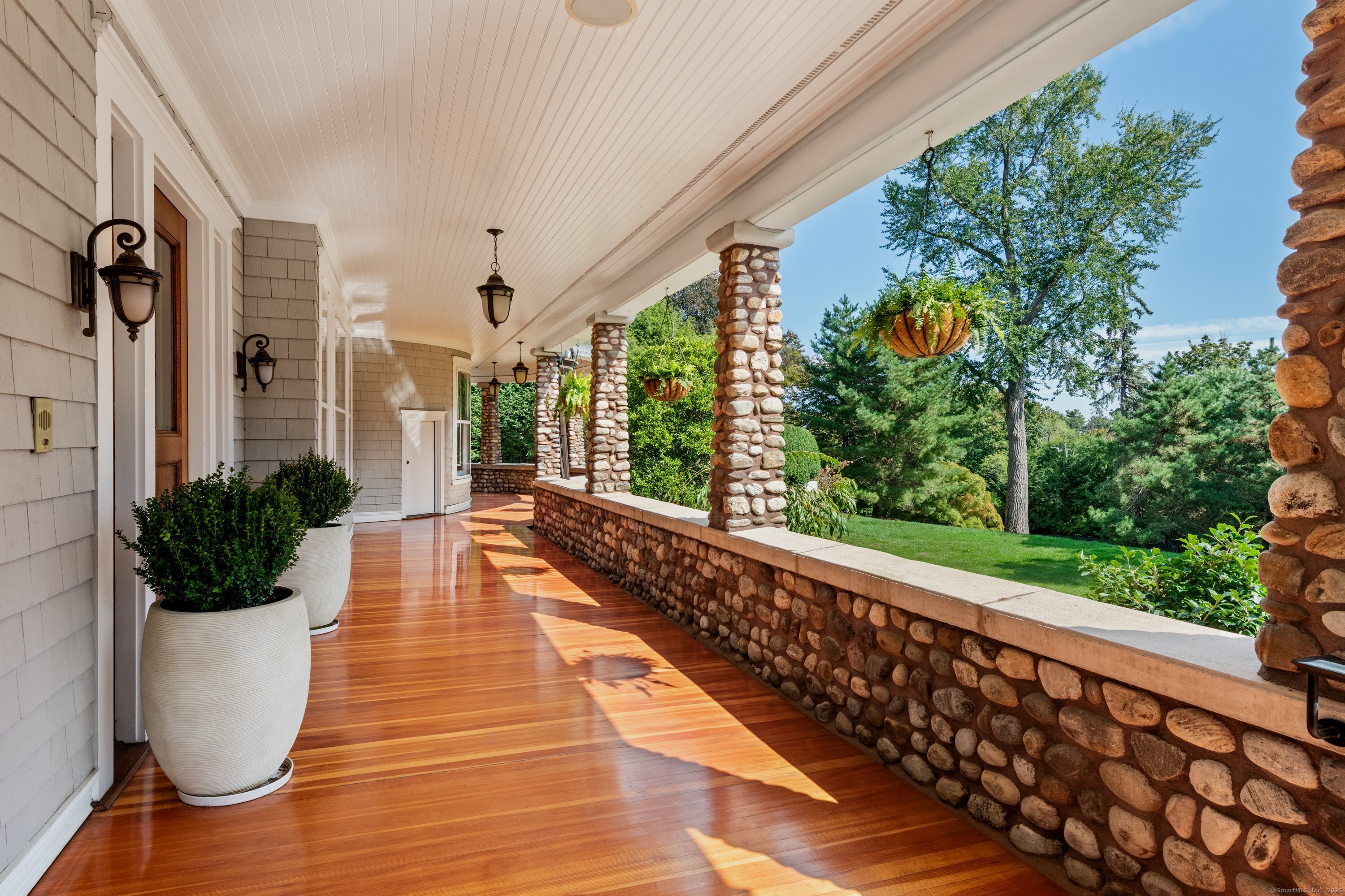 249 Greens Farms Road Westport, CT 06880 - Photo 22 of 40 a view of a balcony with potted plants