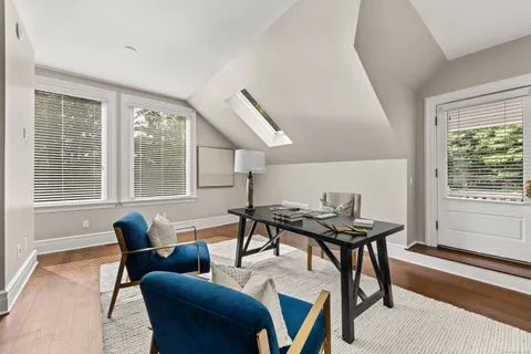 a work room with furniture and windows