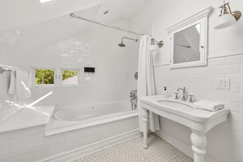 a bathroom with a bathtub and a sink