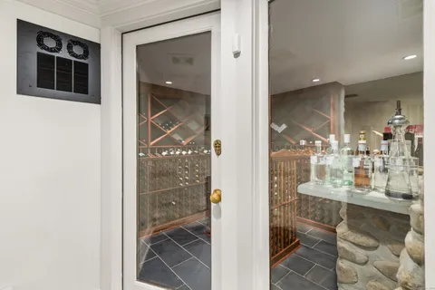 a bathroom with a glass shower door and a sink