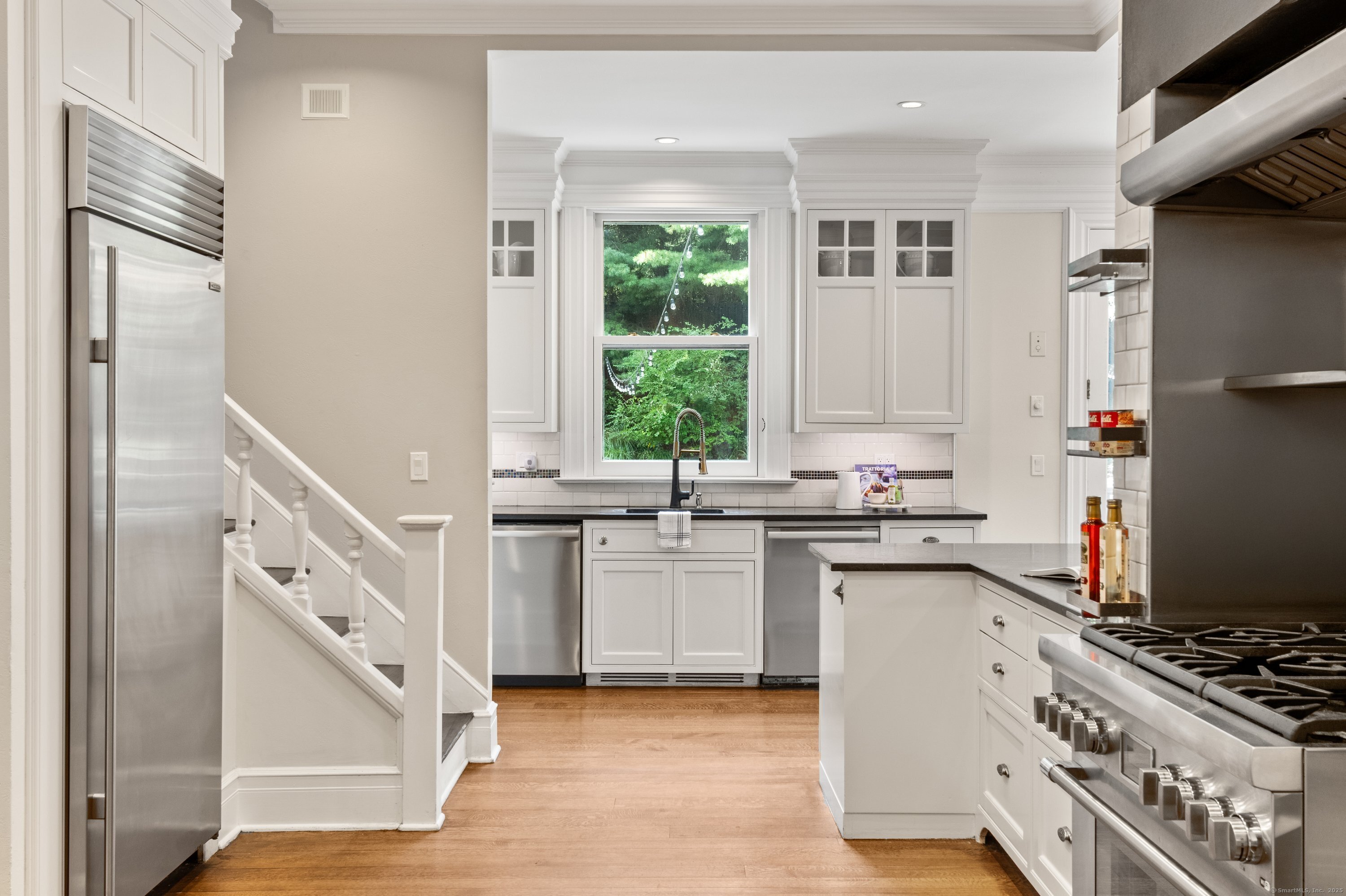 249 Greens Farms Road Westport, CT 06880 - Photo 5 of 40 a kitchen with a sink stove and refrigerator