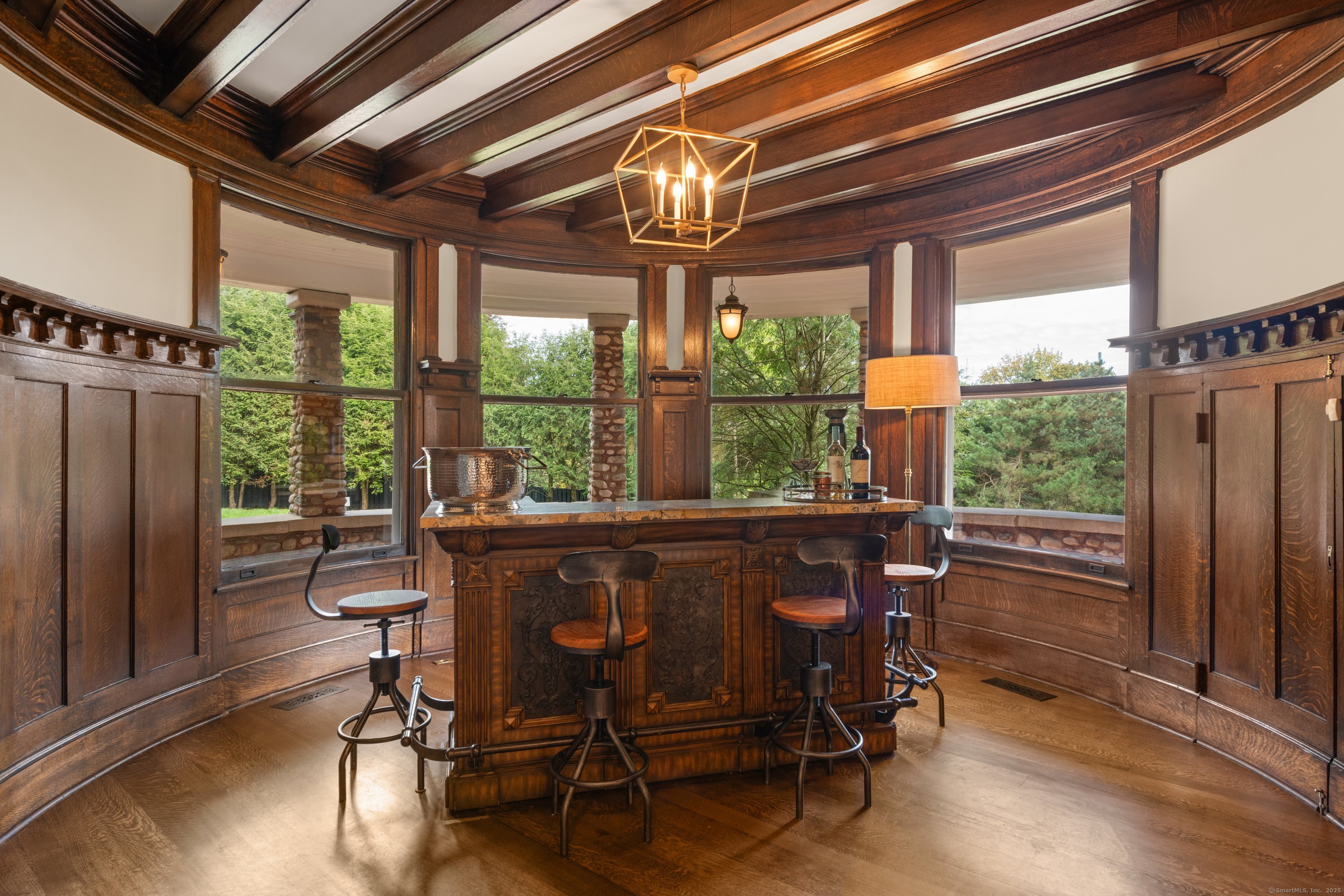 249 Greens Farms Road Westport, CT 06880 - Photo 5 of 40 a dining space with furniture window wooden floor and garden view