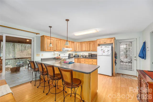 a kitchen with a table and chairs in it