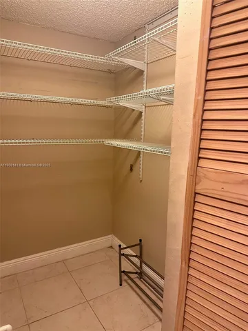 a view of a room with racks on the wall