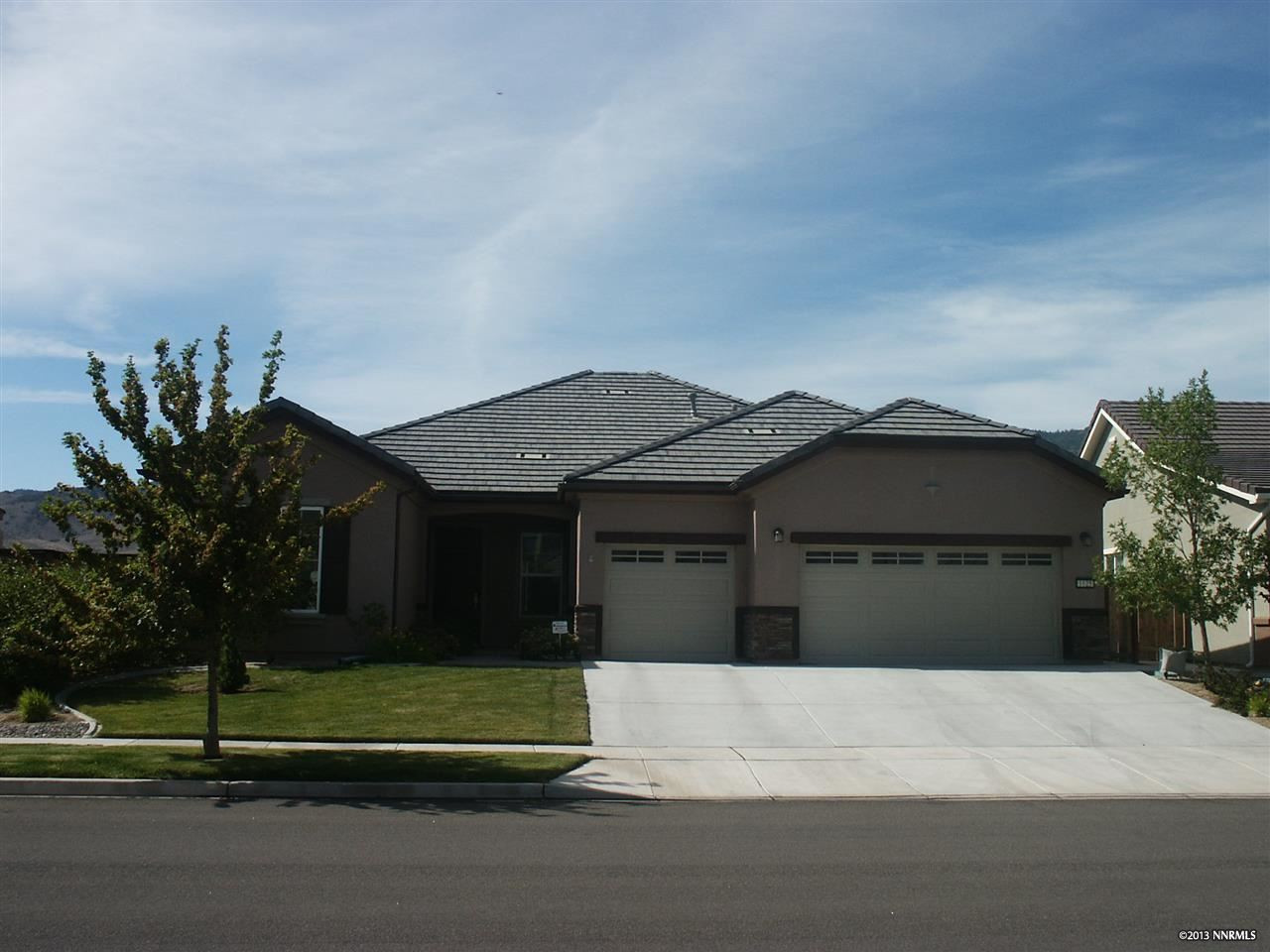 1125 Meridian Ranch Drive Reno, NV 89523 - Photo 1 of 1 a front view of a house with a garden and yard