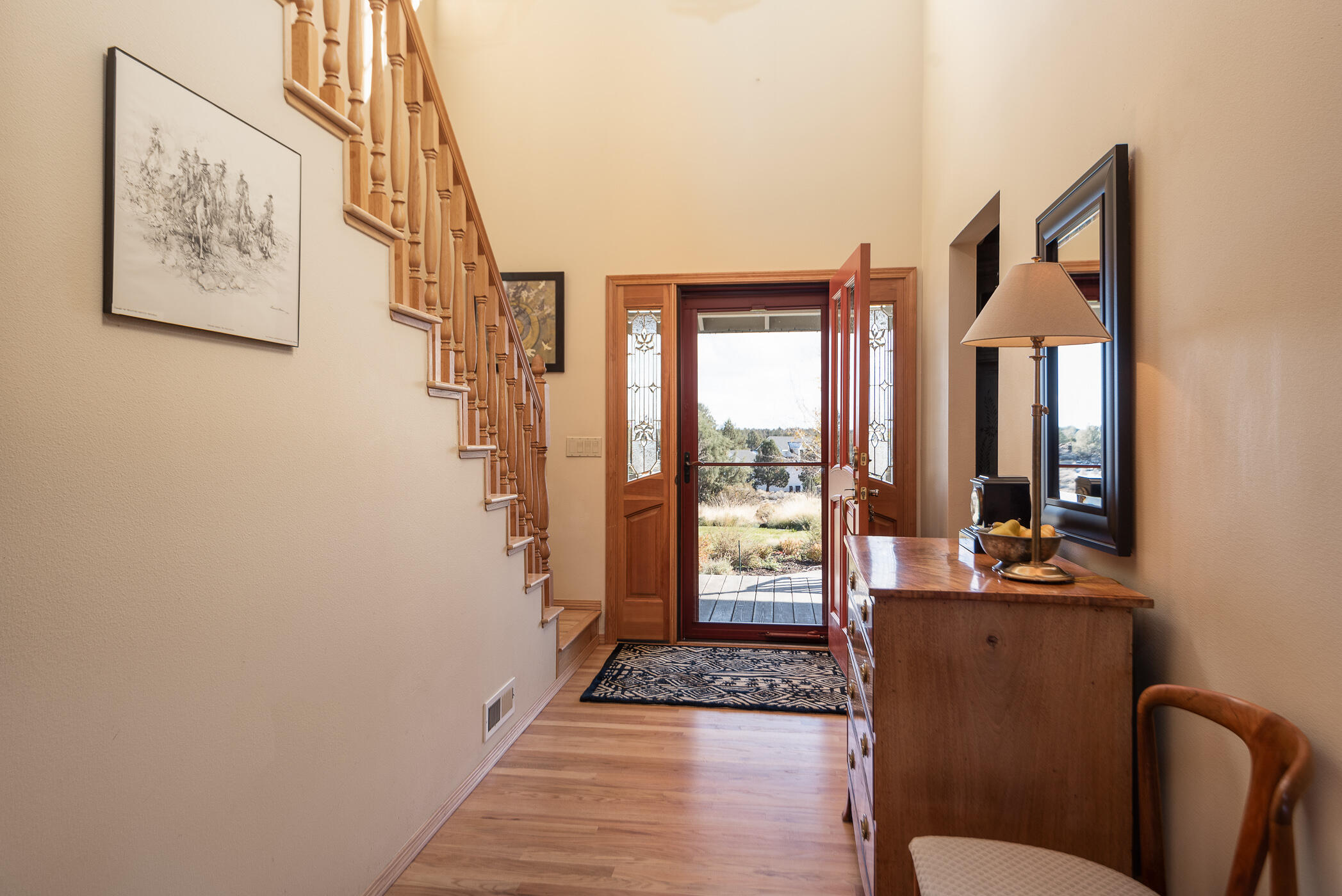 60835 Jennings Road Bend, OR 97702 - Photo 9 of 53 Windows in the door system allow light to flood into the vaulted foyer