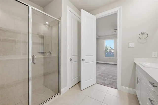 a bathroom with a shower and a sink