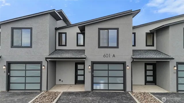 a front view of a house with a garage
