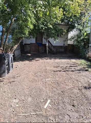 a view of a backyard of the house