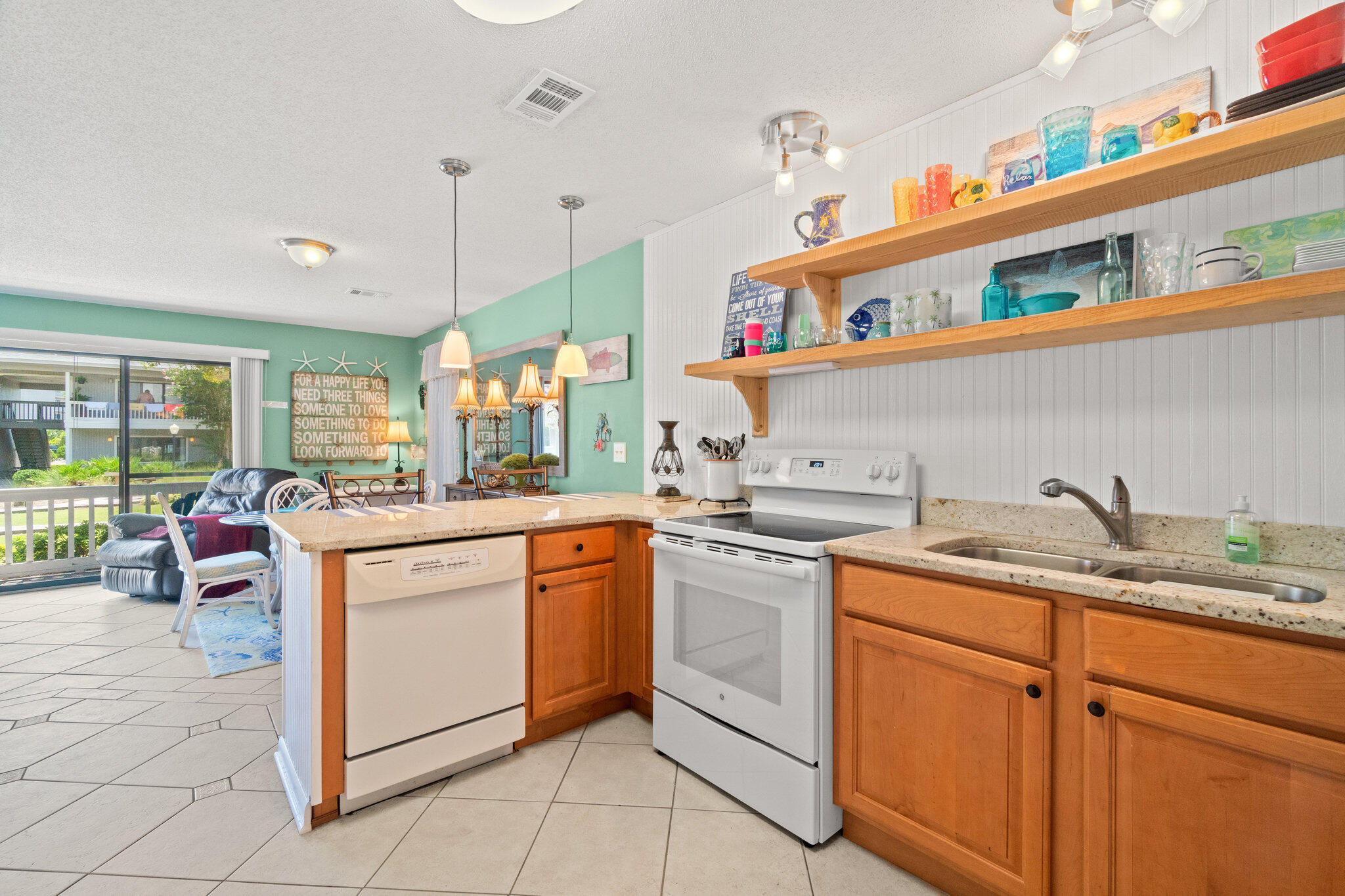 3799 East County Highway 30A, Unit E6 Santa Rosa Beach, FL 32459 - Photo 6 of 23 a kitchen with stainless steel appliances granite countertop a sink and cabinets