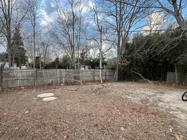 a backyard of apartments with large trees