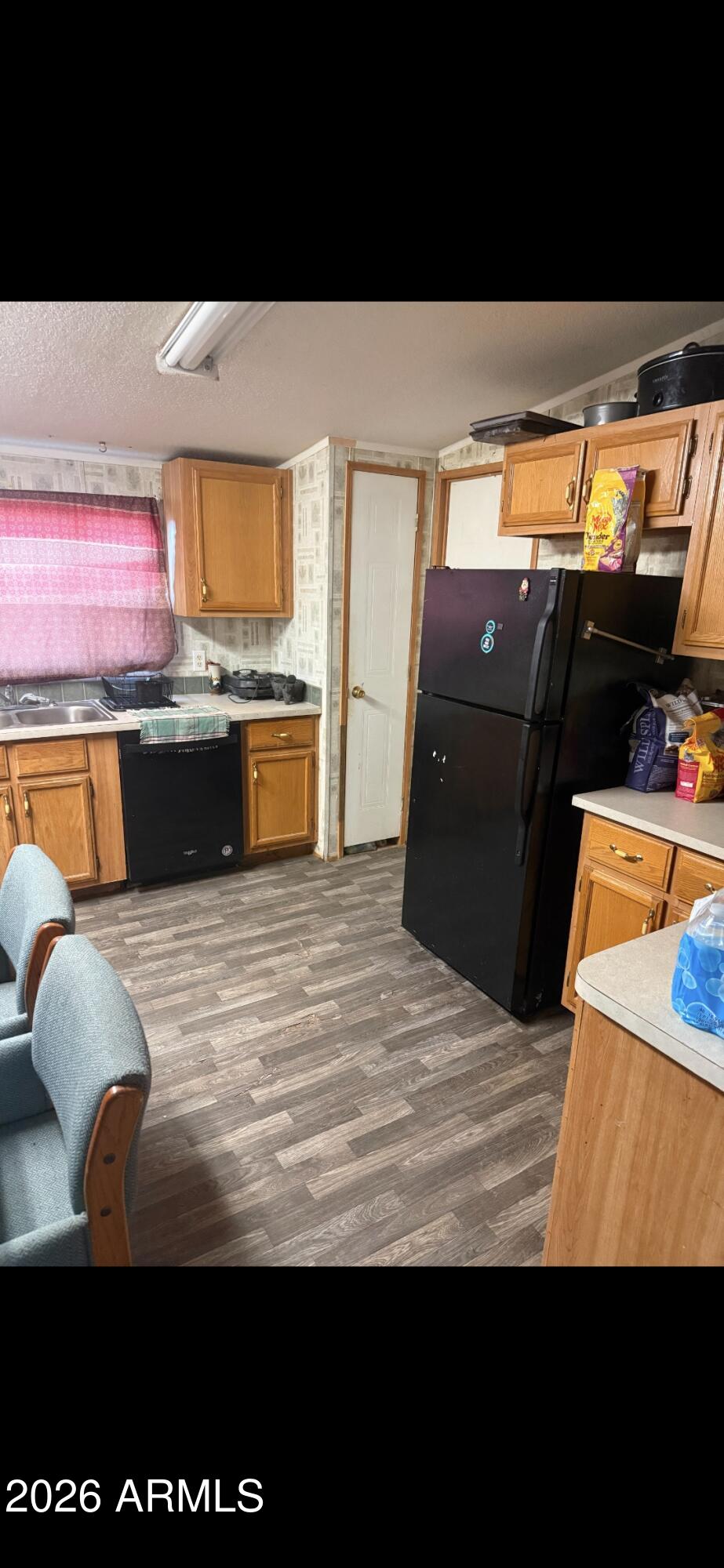 2625 Saddle Vista Road Tonopah, AZ 85354 - Photo 10 of 19 a view of kitchen with stainless steel appliances wooden floor