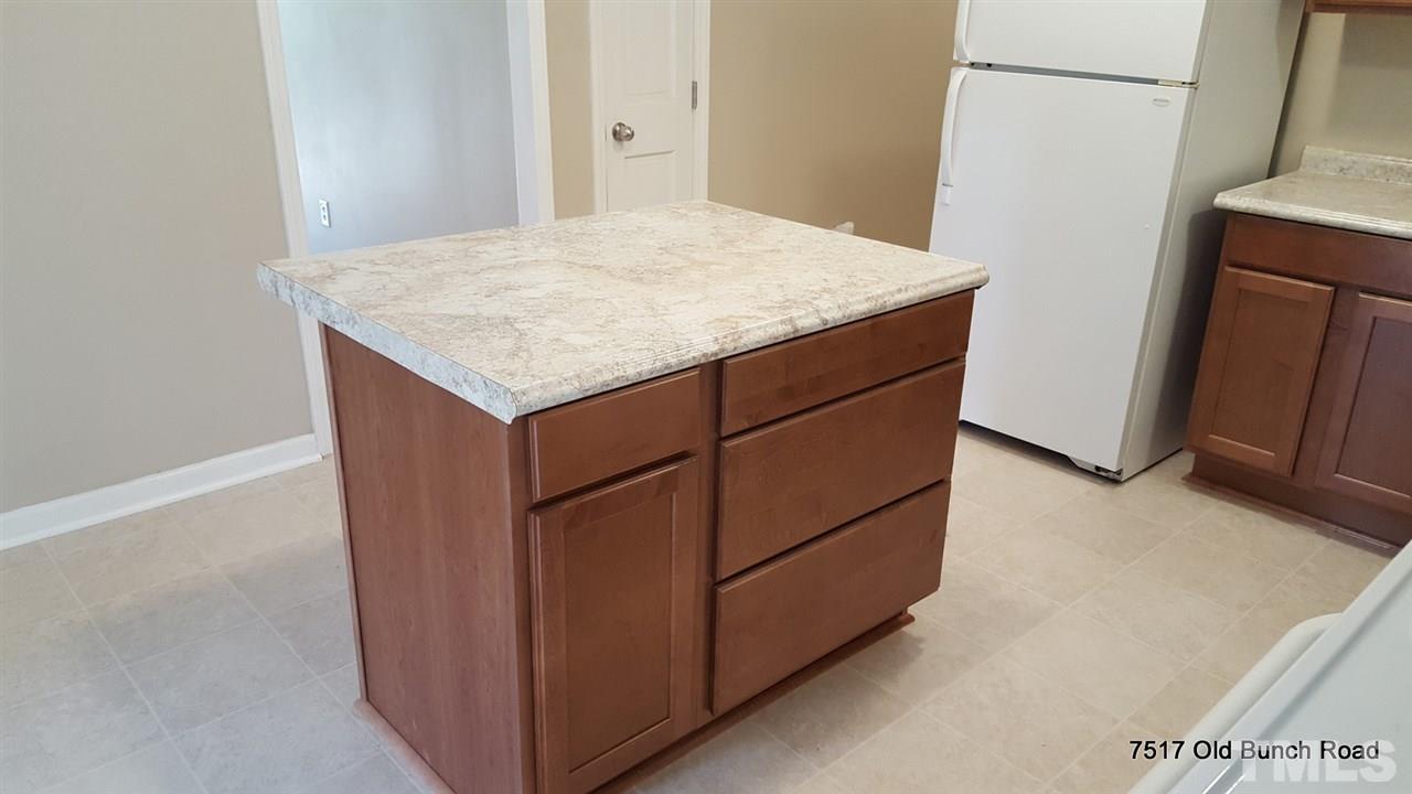 7517 Old Bunch Road Zebulon, NC 27597 - Photo 12 of 25 a utility room with cabinets