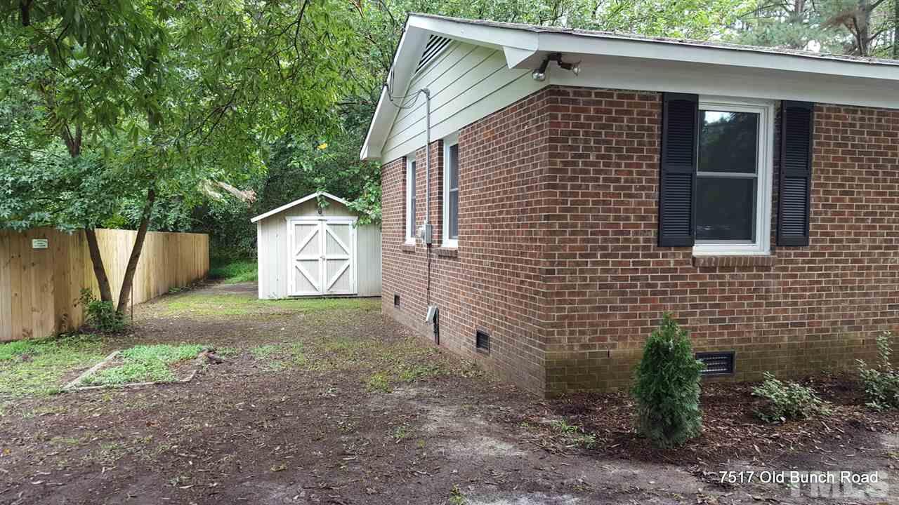 7517 Old Bunch Road Zebulon, NC 27597 - Photo 25 of 25 a front view of a house with garden