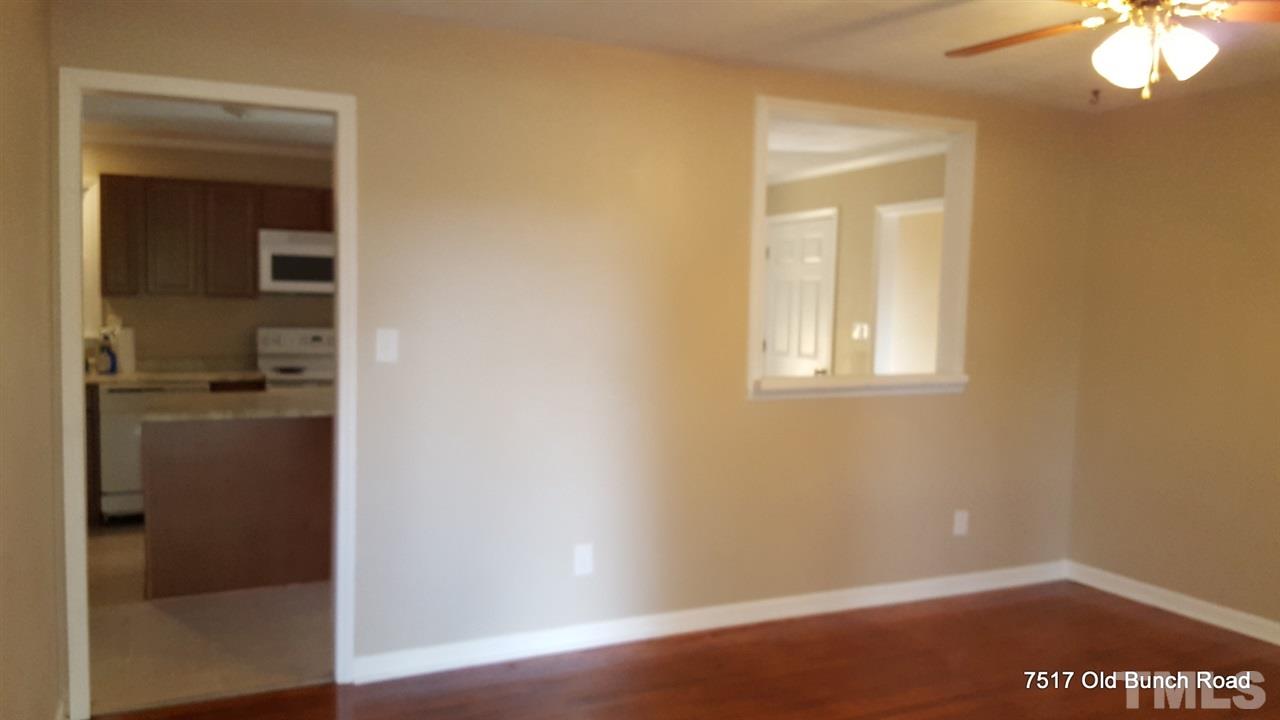 7517 Old Bunch Road Zebulon, NC 27597 - Photo 5 of 25 a view of empty room with wooden floor