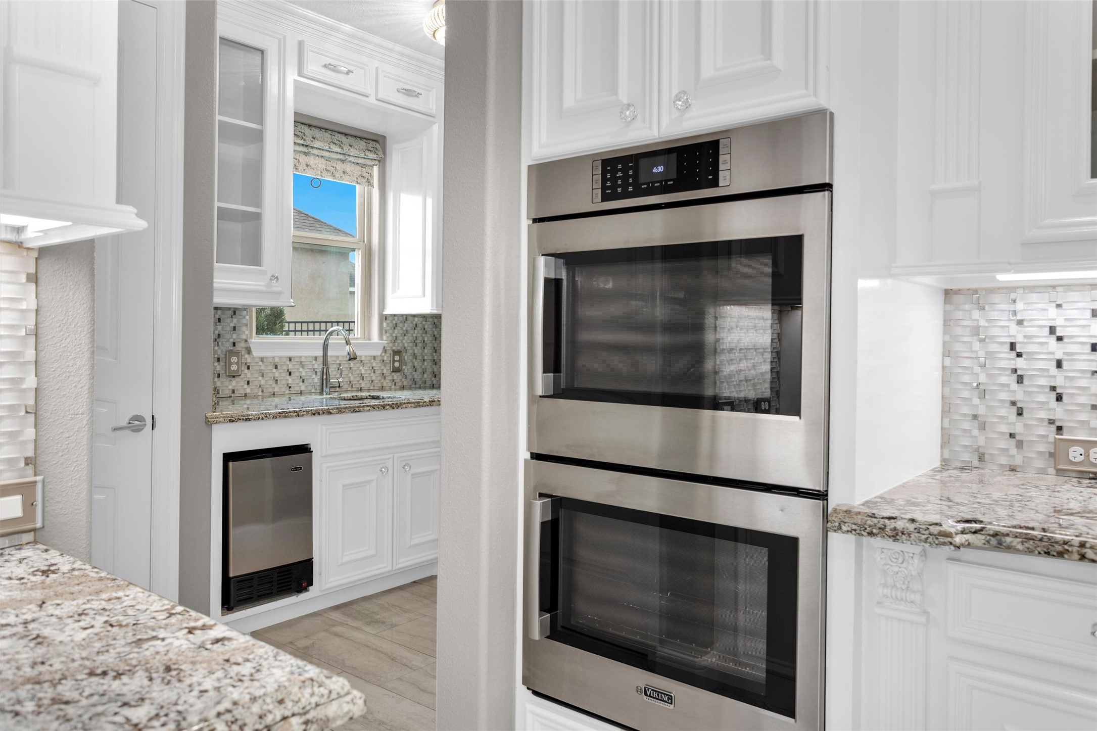 10887 Decatur Street Willis, TX 77318 - Photo 19 of 50 2 of the 4 total ovens offer serious cooking capacity with a door leading directly into the butler’s pantry for added prep and storage.