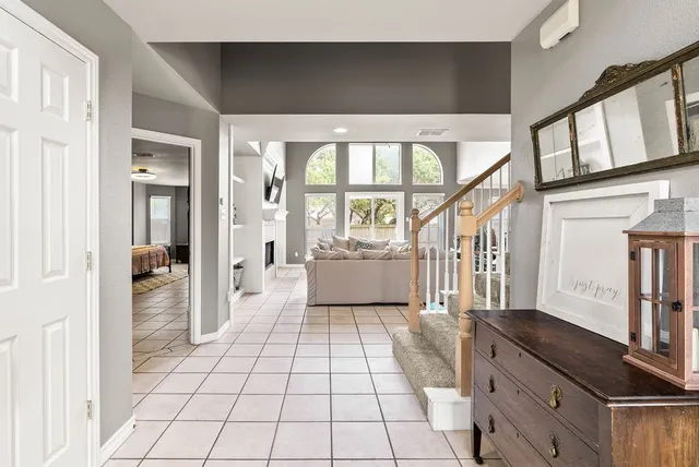 a bathroom with a tub shower vanity and a sink