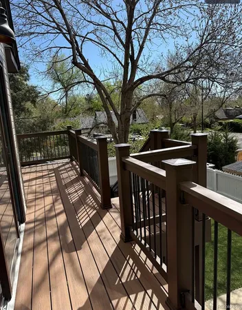 a view of balcony with wooden floor and outdoor space