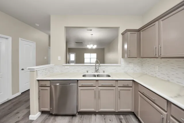 a bathroom with a sink toilet and a mirror