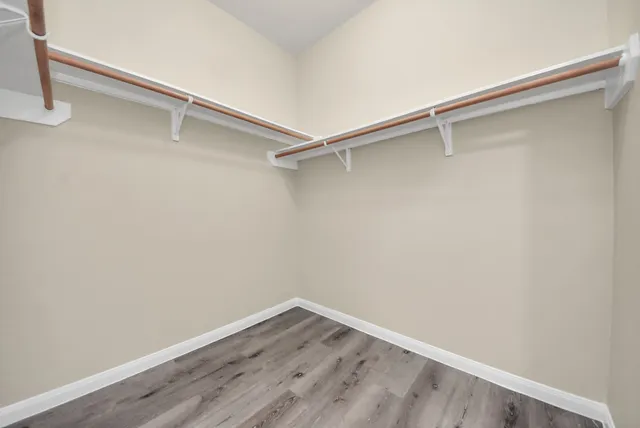a bathroom with a double vanity sink and mirror