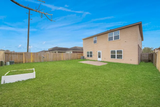 a view of backyard with green space