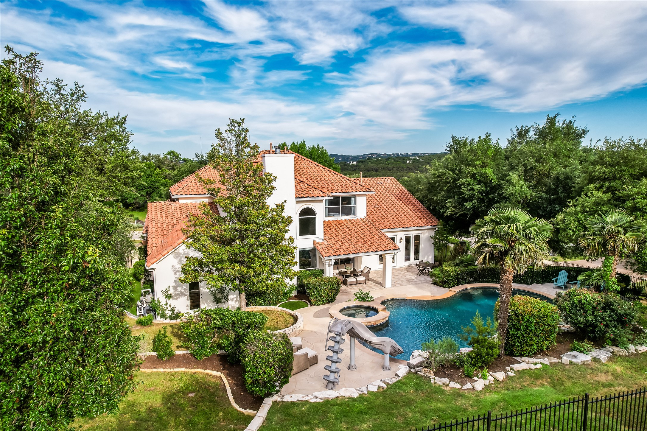 View of pool featuring a patio and a pool with connected hot tub