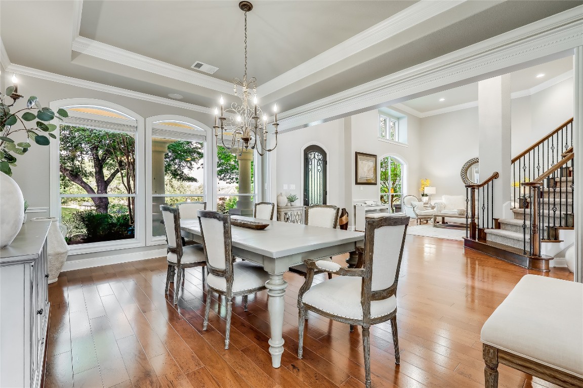 2116 Demona Drive Austin, TX 78733 - Photo 11 of 40 a view of a dining room with furniture window and wooden floor