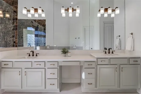a bathroom with a sink vanity and a mirror