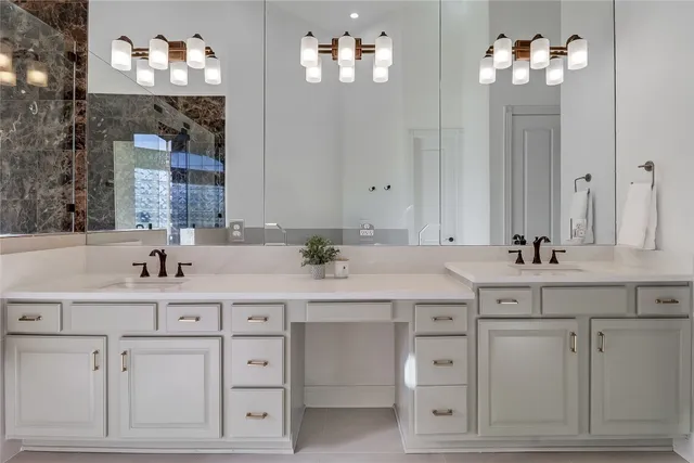 a bathroom with a sink vanity and a mirror