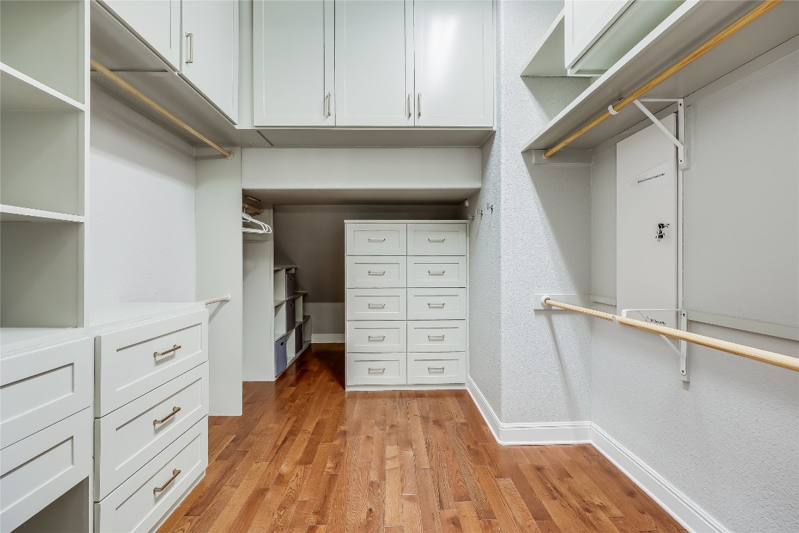 2116 Demona Drive Austin, TX 78733 - Photo 17 of 40 a view of walk in closet with empty racks