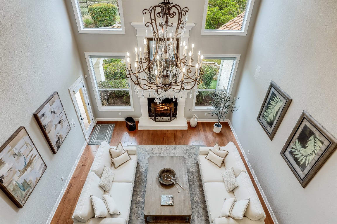 2116 Demona Drive Austin, TX 78733 - Photo 19 of 40 a view of living room with furniture and a chandelier