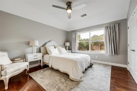 a bedroom with bed and a window