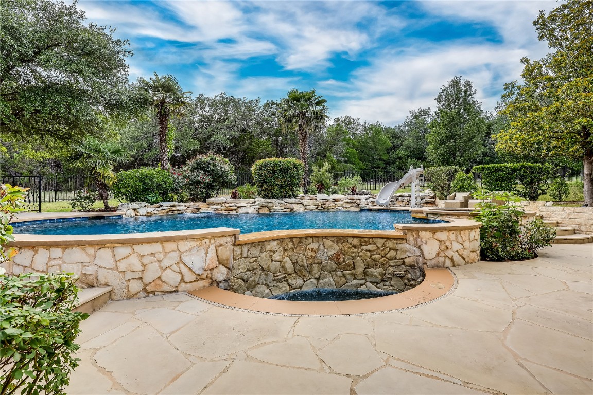 2116 Demona Drive Austin, TX 78733 - Photo 29 of 40 a view of a swimming pool with a yard