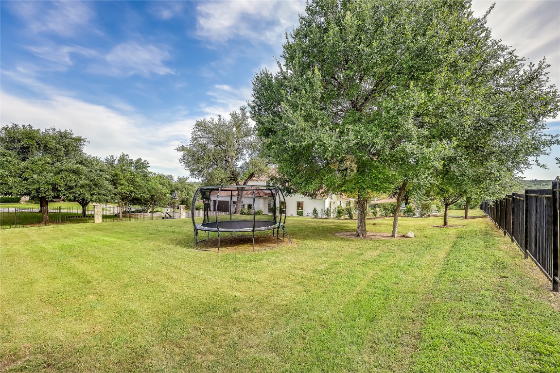 2116 Demona Drive Austin, TX 78733 - Photo 31 of 40 a swimming pool with trees in the background