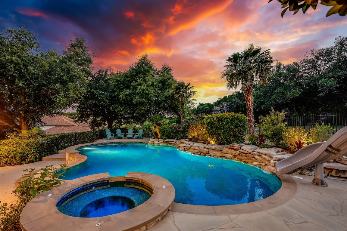 2116 Demona Drive Austin, TX 78733 - Photo 33 of 40 a view of a swimming pool with a yard from a tub