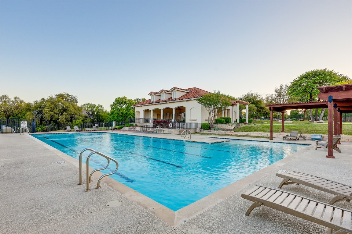 2116 Demona Drive Austin, TX 78733 - Photo 38 of 40 a view of a swimming pool with a lounge chair
