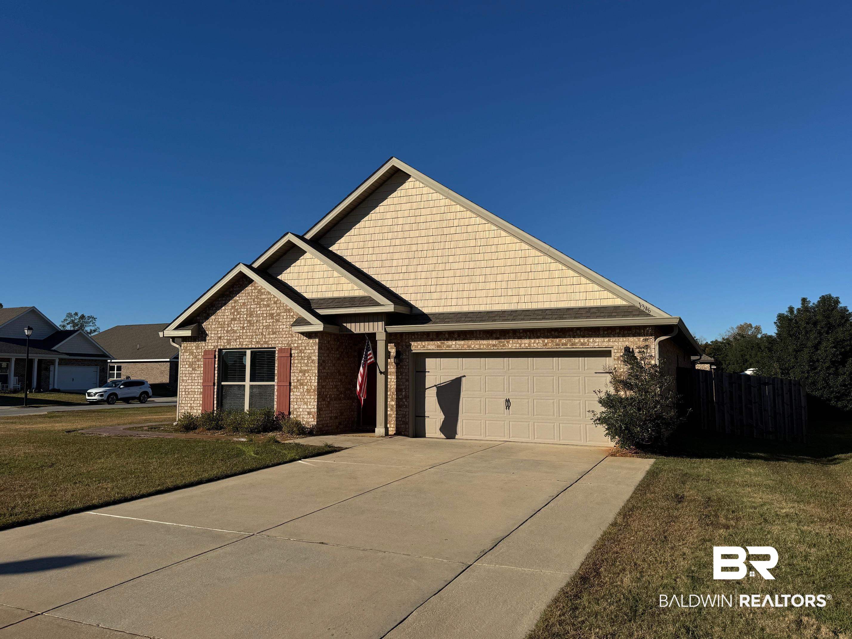 1346 Kairos Loop Foley, AL 36535 - Photo 33 of 40 Craftsman-style house with a front yard and a garage