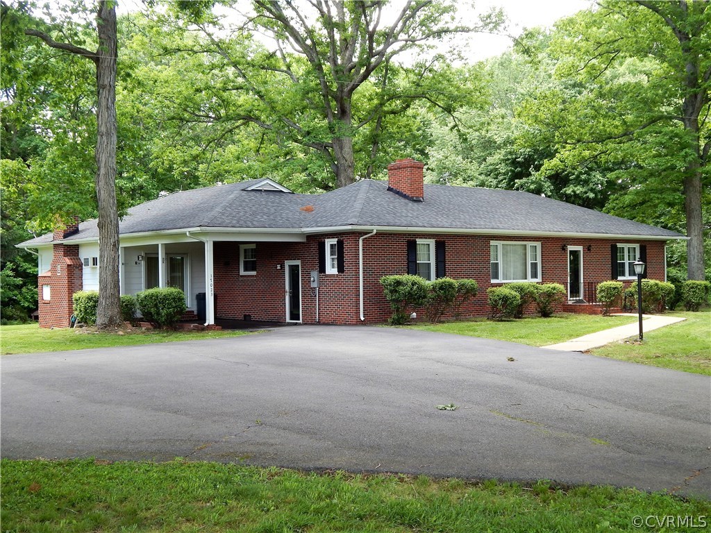 17023 Old Ridge Road Montpelier, VA 23192 - Photo 3 of 19 a front view of a house with a yard and garage