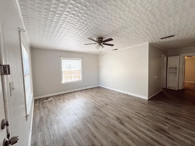 a view of an empty room and window