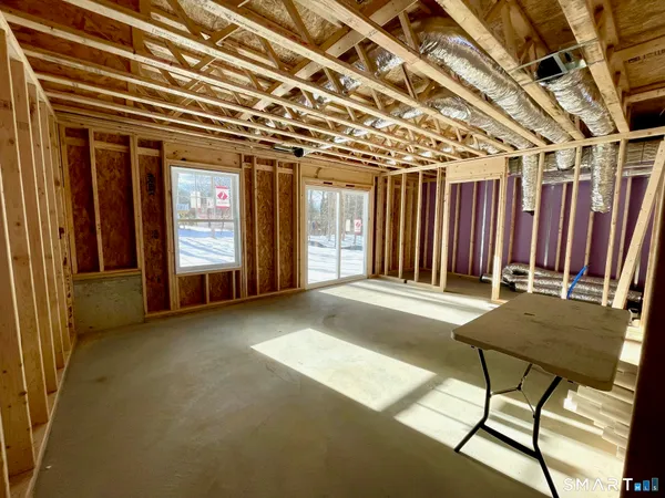 a view of a porch with a table and chairs