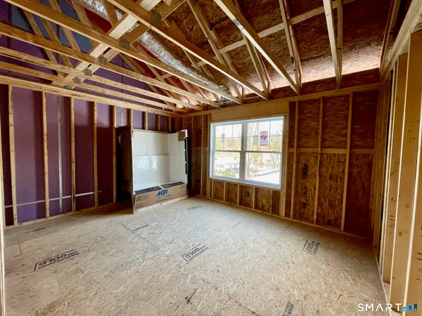 a view of a tennis ground with large trees