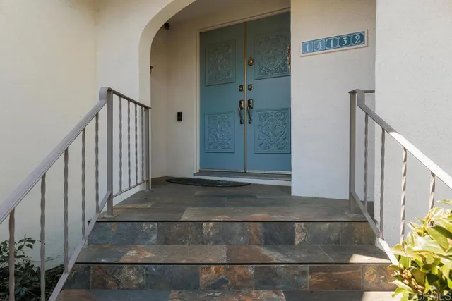 a view of a livingroom with furniture and a potted plant