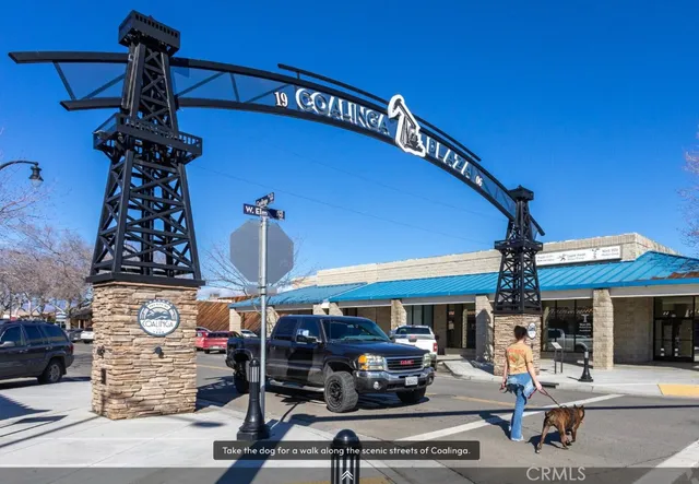 a view of a patio with a table and chairs