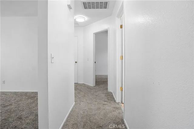 a view of a hallway with a white walls