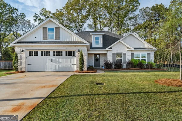 a front view of a house with a yard